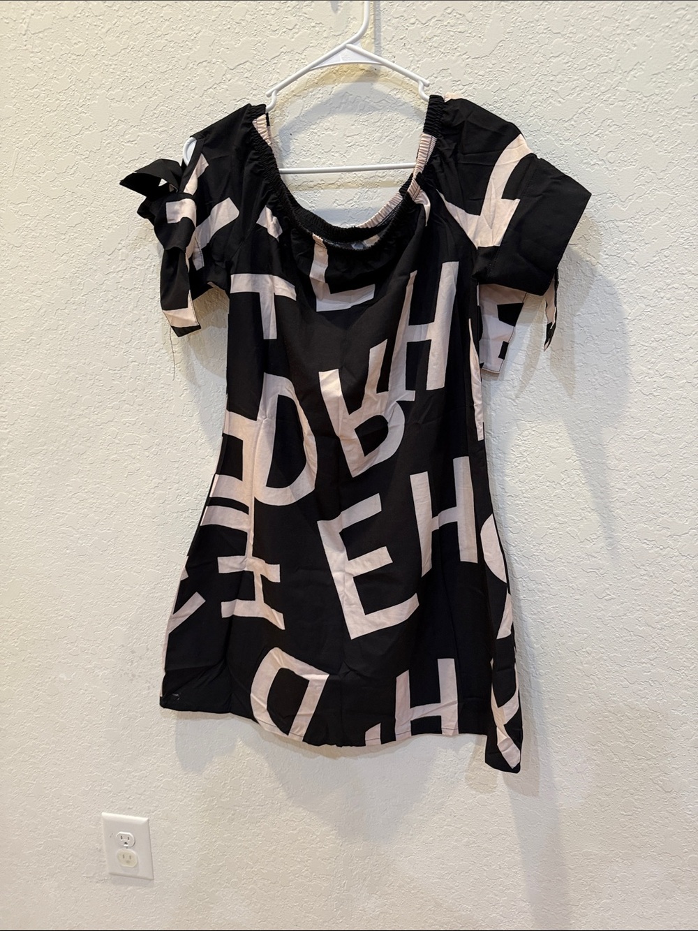 Black and Cream Graphic Lettering Off-Shoulder Dress
